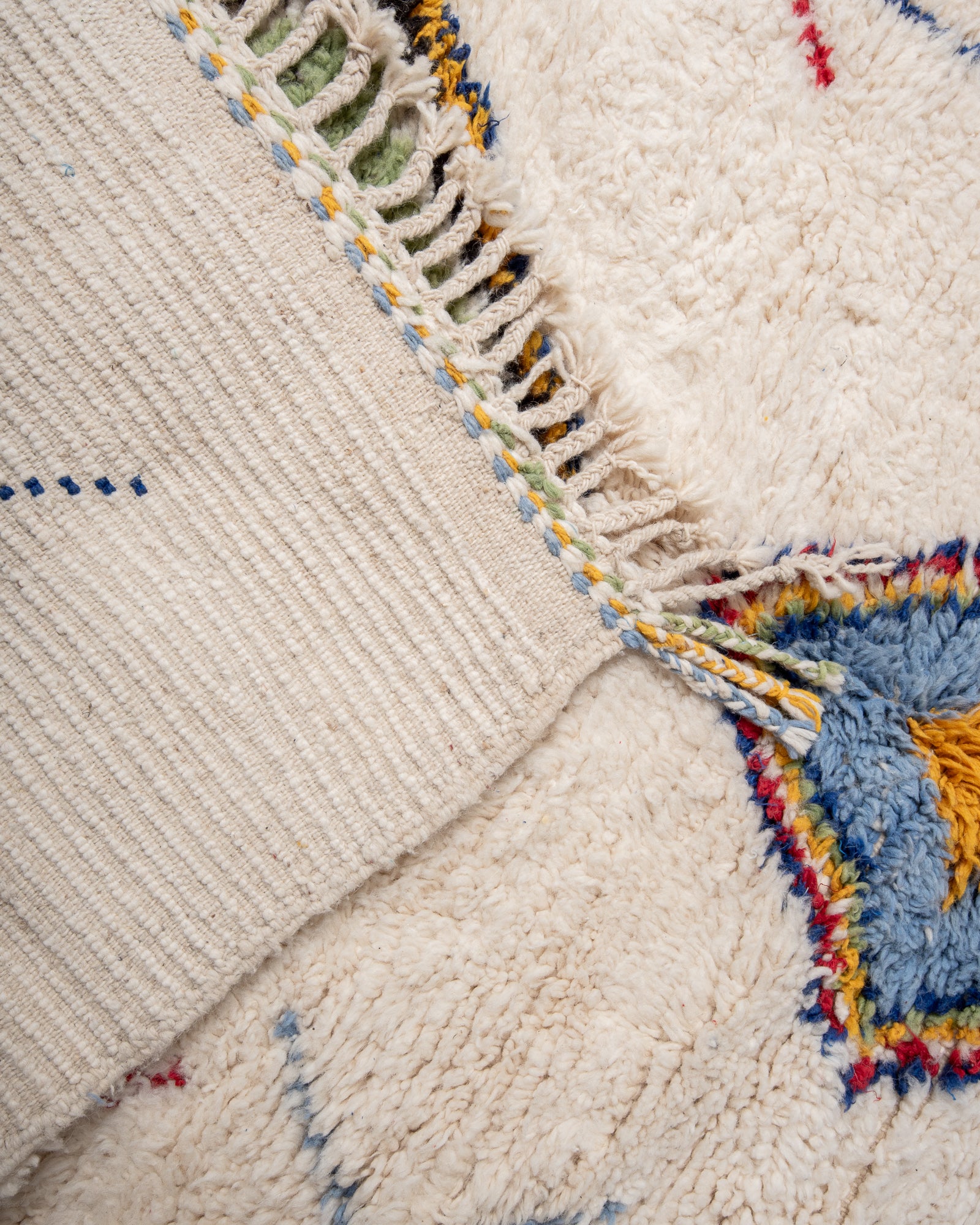 Modern, designer, handcrafted Berber rug from Morocco. Beniourain carpet with beautiful colours and patterns and fluffy wool texture.